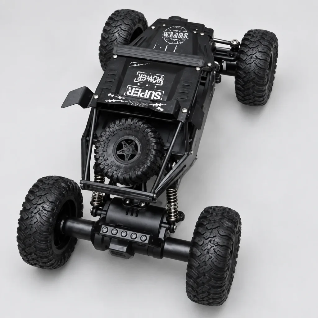 Top view of a black open-frame RC crawler with a top-mounted spare tyre