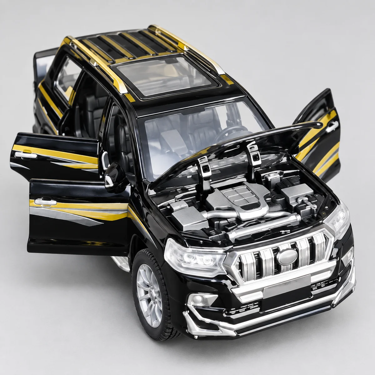 Black and gold TX Prado diecast RC SUV with open bonnet and doors