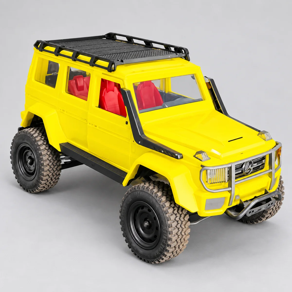 Yellow boxy off-road RC SUV with a black roof rack